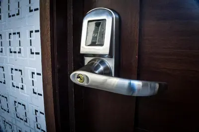 a cell phone sticking out of a door at Malecon Premium Rooms & Hotel in Santo Domingo