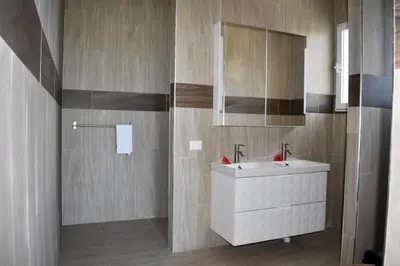 a bathroom with a white sink and a mirror at Villa Laëti in Las Terrenas