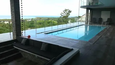 a swimming pool with a view of the ocean at Villa Laëti in Las Terrenas