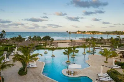 an aerial view of a resort with a pool and the ocean at Dreams Macao Beach Punta Cana - All Inclusive in Punta Cana