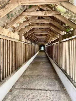 a wooden bridge with a long walk way at Elegante Aqua Marine Apartamento Juan Dolio in Juan Dolio