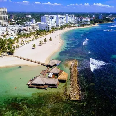 an aerial view of a resort on a beach at Elegante Aqua Marine Apartamento Juan Dolio in Juan Dolio