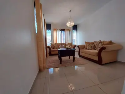 a living room with couches and a coffee table at 6-1 SANTIAGO CITY GREAT COZY APT TO STAY - Cozy 3 bedrooms Apartment for 7 peoples - close to all kind the business wifi - Air Condition in Santiago de los Caballeros