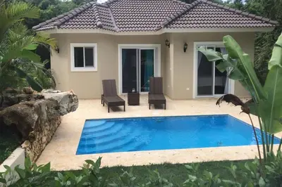 a swimming pool in front of a house at 2 Bed 2 Bath Villa with Jacuzzi, High Speed Wi-Fi in Sosúa