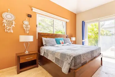 a bedroom with a bed and a window at 2 Bed 2 Bath Villa with Jacuzzi, High Speed Wi-Fi in Sosúa