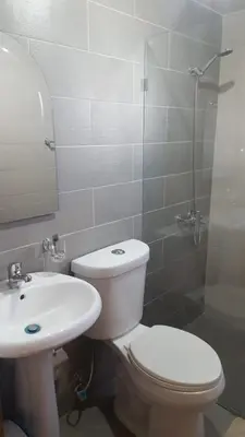 a bathroom with a toilet and a sink and a shower at Verano 2019 in Santiago de los Caballeros