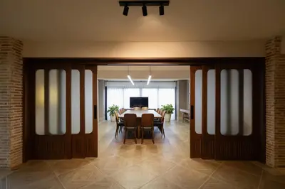 a dining room with a table and some chairs at Camp David Ranch in Santiago de los Caballeros