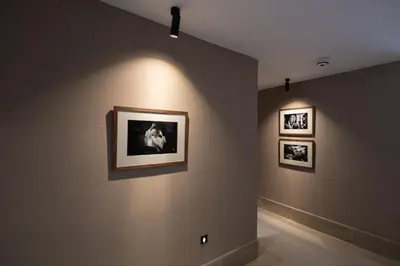 a room with three pictures on the wall at Camp David Ranch in Santiago de los Caballeros