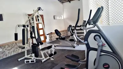 a gym with two tread machines and a treadmill at Matum Hotel & Casino in Santiago de los Caballeros