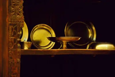 a shelf with plates and a bowl on it at Matum Hotel & Casino in Santiago de los Caballeros