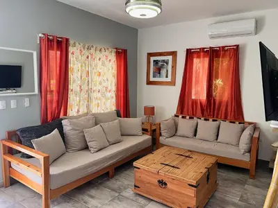 a living room with a couch and a coffee table at Casa Lambí in Cabrera