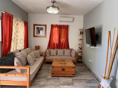 a living room with a couch and a table at Casa Lambí in Cabrera