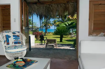 an open door to a patio with a view of the ocean at Studio Lotte - Ocean Front in Las Galeras