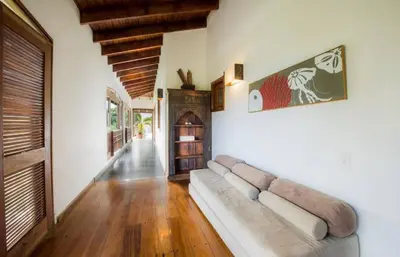 a living room with a couch in the middle of a room at Penthouse Las Playas in Las Terrenas