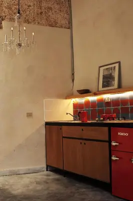 a kitchen with a sink and a counter top at FIXIE LOFTS - Colonial Villa Suites with Pool in Santo Domingo