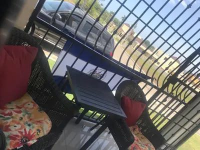a room with a table and chairs and a window at 2bedroom mountain view villa #2 in Muñoz