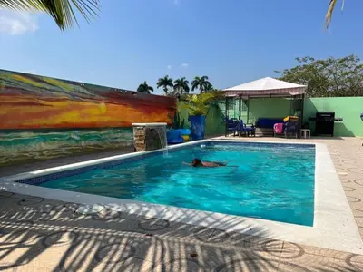 a person swimming in a swimming pool at 2bedroom mountain view villa #2 in Muñoz