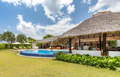 an image of a resort with a swimming pool at Unique Villa with Ocean and River Views - Staff & Golf Carts in La Romana