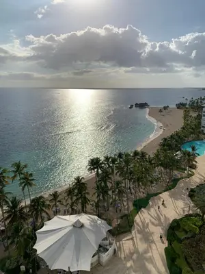 an overhead view of a beach with an umbrella at Luxury penthouse portobello in Santo Domingo