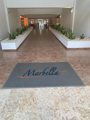 a lobby with a mat in the middle of a building at Luxury penthouse portobello in Santo Domingo