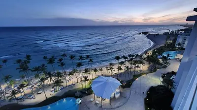 an aerial view of a beach with an umbrella at Luxury penthouse portobello in Santo Domingo