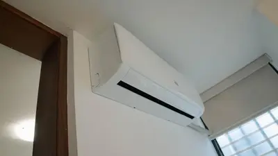 a white hood in a room with a window at Residenciales H1 & H2 - Breakfast & Room Service - Airport close in Santiago de los Caballeros
