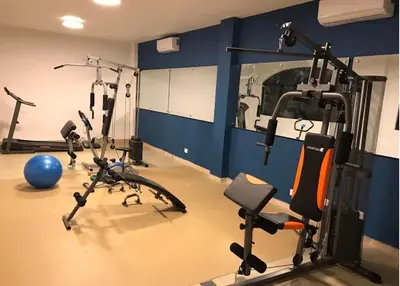 a gym with several exercise bikes in a room at The biggest swimming pool in Sosua, frente a la piscina más grande en sosua in Sosúa