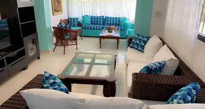 a living room with a couch and a table at La Gaviota B1 in Juan Dolio