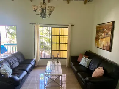 a living room with a couch and a coffee table at Oasis de Paz 3 in Jarabacoa