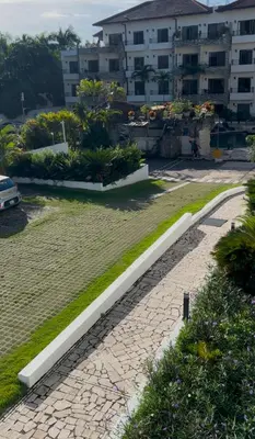 a walkway in a park next to a building at Best ocean view Sosua-Cabarete in Sosúa