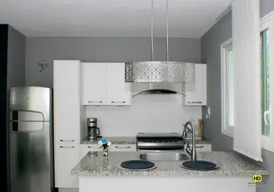 a kitchen with white cabinets and a stainless steel refrigerator at Apartamento Estrella Dominicus in La Laguna