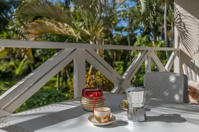 a table with two cups and a glass on it at Ballenas beach C6 in Las Terrenas