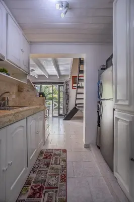 a kitchen with a sink and a refrigerator at Ballenas beach C6 in Las Terrenas