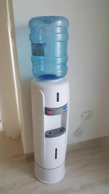 a water cooler with a bucket on top of it at Saman Terrace in Las Terrenas