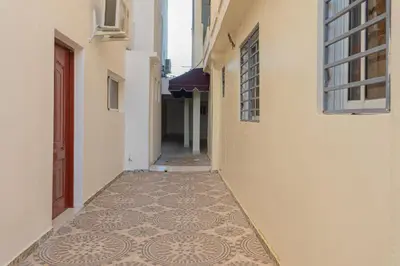 an alley with a tiled floor in a building at Modern Tropical Studio with Terrace 300 Mbps Wi-Fi, Generator Gated Parking in La Viva