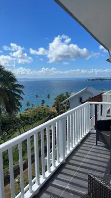 a view of the ocean from the balcony of a house at Vista Mare Samana Amazing Views!! in Santa Bárbara de Samaná