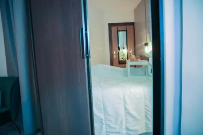 a view of a bedroom with a bed and a mirror at HOTEL ALKQUIMIA in Bayahibe