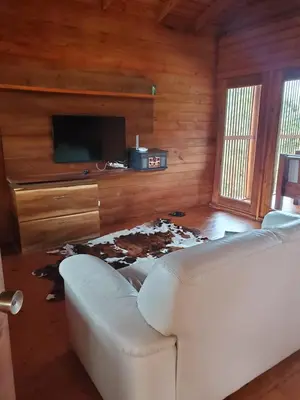 a living room with a couch and a pile of debris at Estancias Arroyazo in Constanza