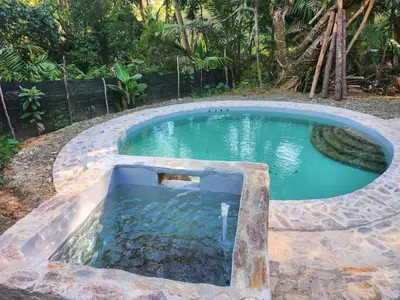 a small pool of water in a yard at Estancias Arroyazo in Constanza