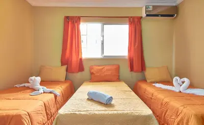 a room with two beds with stuffed animals on them at Modern Tropical 2-Bedroom Apartment with Terrace 300 Mbps Wi-Fi, power Generator in La Viva