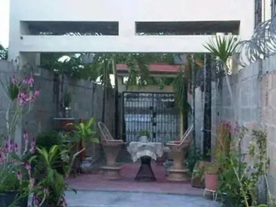 a patio with a gate and some plants at Villa Julirous Rd, spa and aparthotel camp for vacationers in Boca Chica