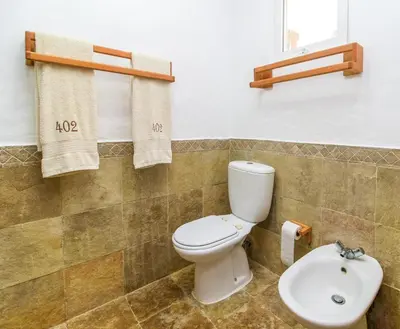 a bathroom with a toilet and a sink at Palmeraie Terrenas beach apartamento in Las Terrenas