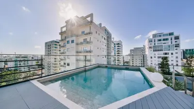 a swimming pool on the balcony of a building at Fully Serviced Apartment at Regatta Living II - 703 in La Julia