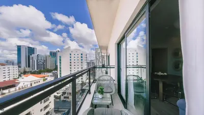 a balcony with a view of a city at Fully Serviced Apartment at Regatta Living - 9F in Santo Domingo