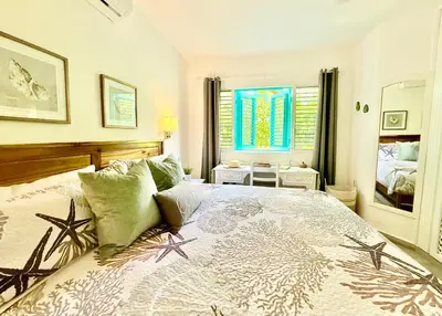 a bedroom with a bed with stars on it at La Dolce Vita Beachfront Apt 2 in Las Terrenas