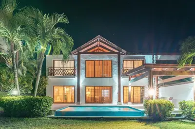 a house with a swimming pool in front of it at The Greatest 3BR Villa at Puerto Bahia in Los Grini