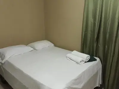 a small bed with two towels on top of it at Apartahotel Next Nivel - One bedroom apartment in Punta Cana