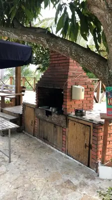 an outdoor brick oven with pots and pans on it at VILLA CAMPESTRE EN LOMAS LINDA in Villa Altagracia