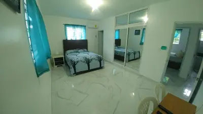 a large room with a bed and a mirror at Apartamento amueblado en Santiago, Res Blue Amber, 2 habitaciones in Santiago de los Caballeros