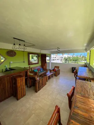 a living room with a pool table and tables at Private Study Punta Cana in Punta Cana